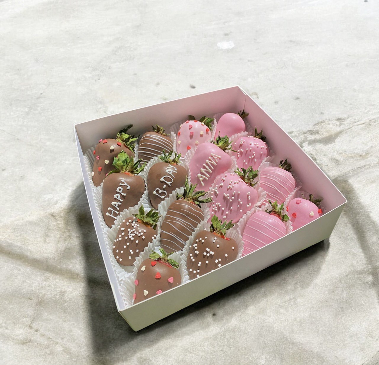 Box with strawberries and inscription