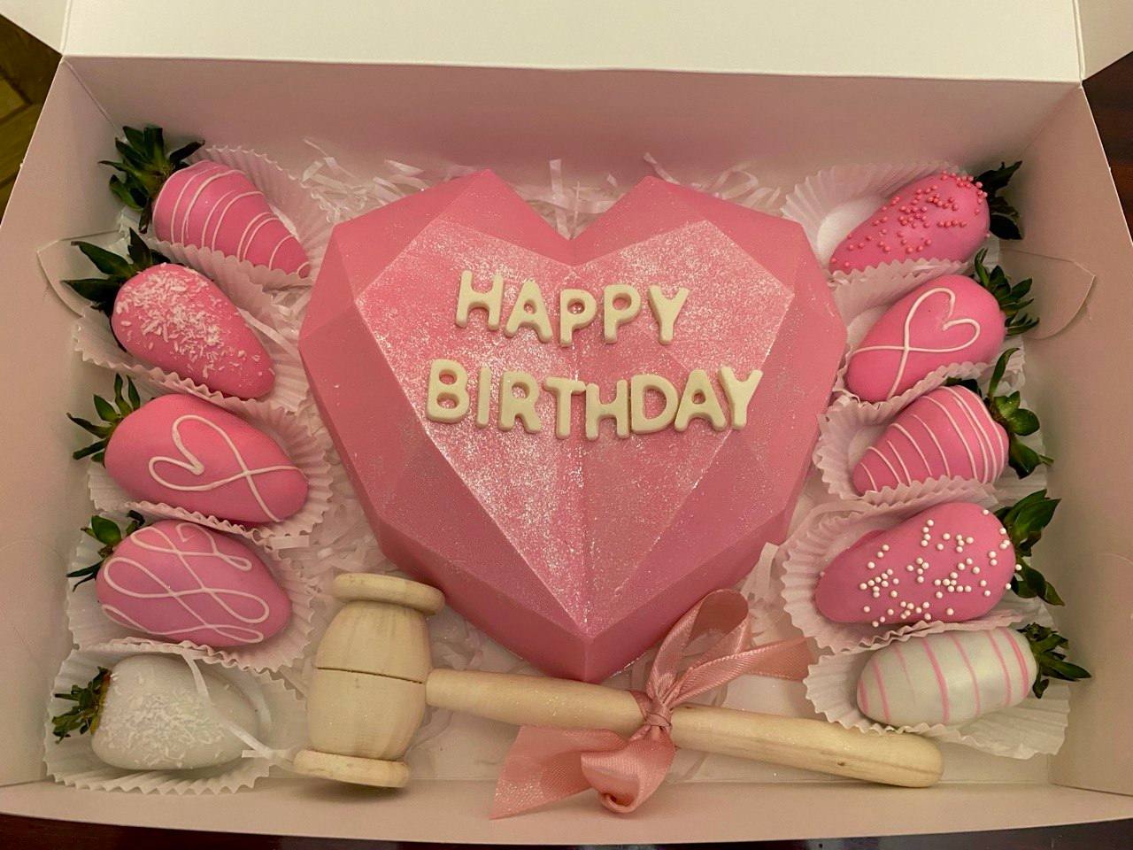 breakable chocolate heart with strawberries