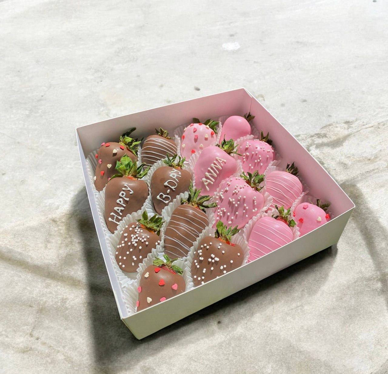 Box with strawberries and inscription