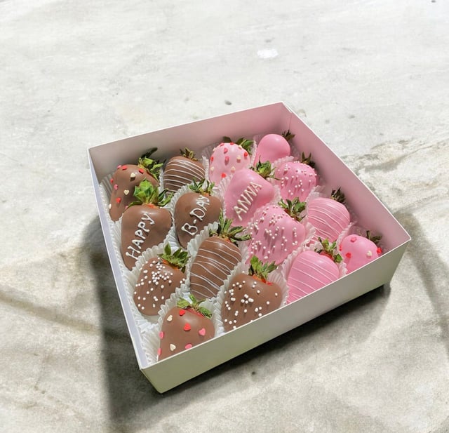 Box with strawberries and inscription